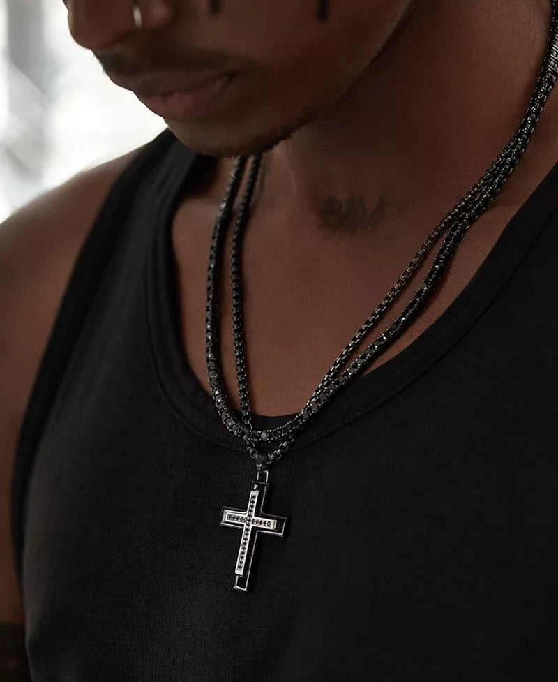 Close up pictured from the left of a man wearing a black diamond tennis chain necklace