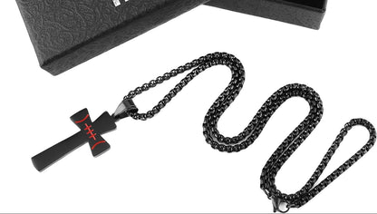 top down picture of black cross football chain necklace for men. Chain is in snae pattern on a white background