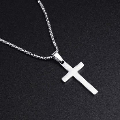 pictured from the left and top-down of a stainless steel men's cross necklace on a black background